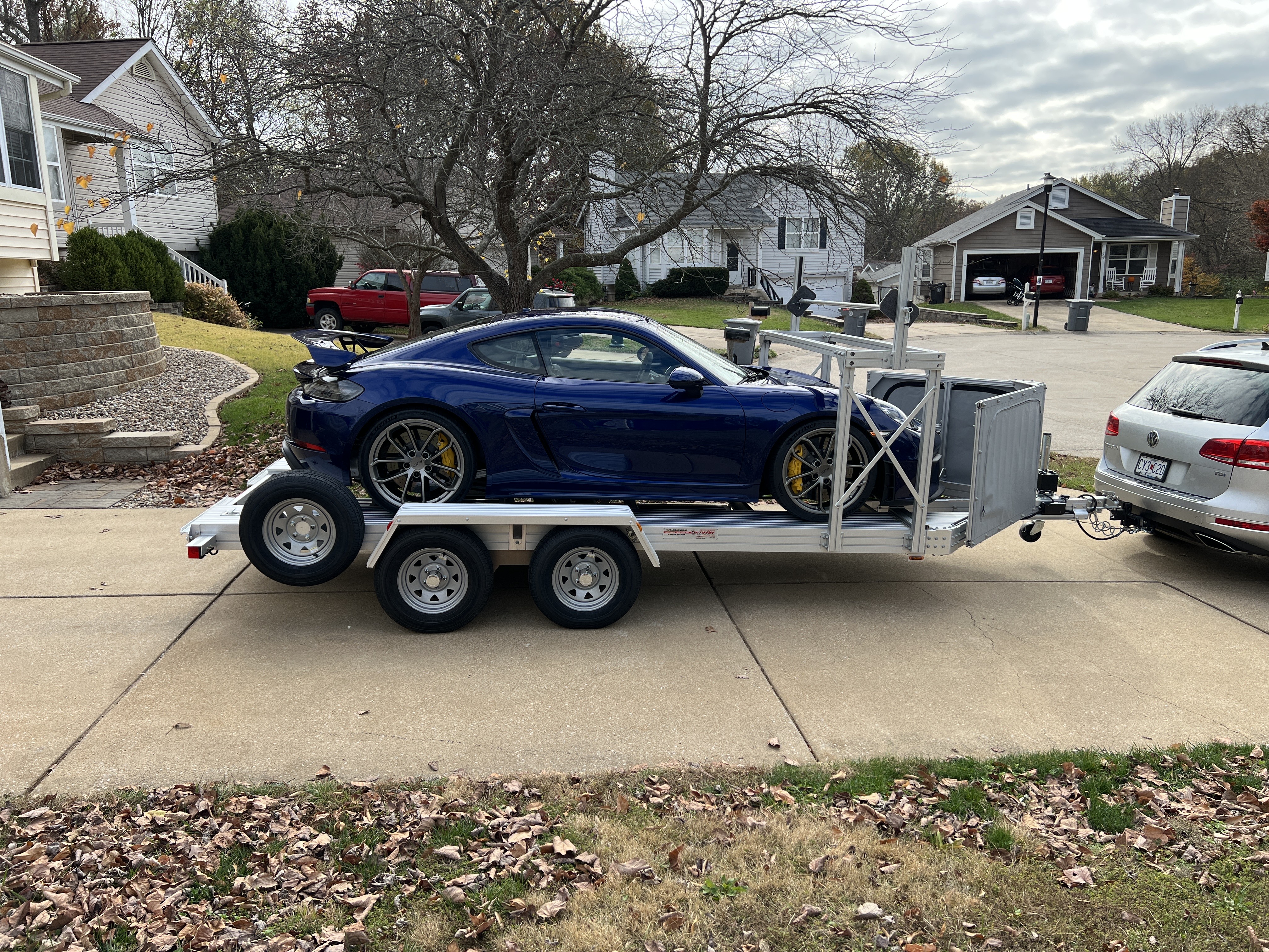 Porsche GT4 on Trailex 8055 open trailer with front shield and tire rack